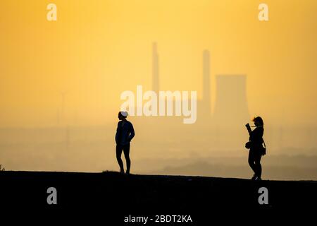 The Haniel slagheap, 185-metre-high tailings pile, at Prosper Haniel colliery, closed down in 2019, people on the way to the slagheap, at the back the Stock Photo