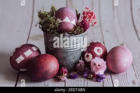 Rose colored Easter composition. Easter eggs on a Rustic background. Stock Photo