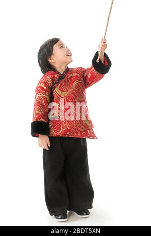 A little boy holding a lantern pole Stock Photo