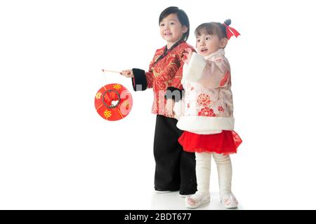 Brother and sister both with red lanterns to celebrate the New Year Stock Photo