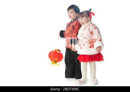 Brother and sister both with red lanterns to celebrate the New Year Stock Photo