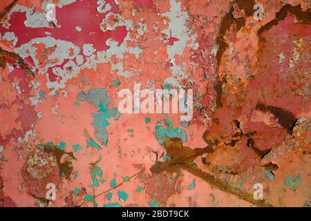 brightly painted but rusting metal surface Stock Photo