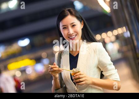 Business lady from work to eat on the road Stock Photo