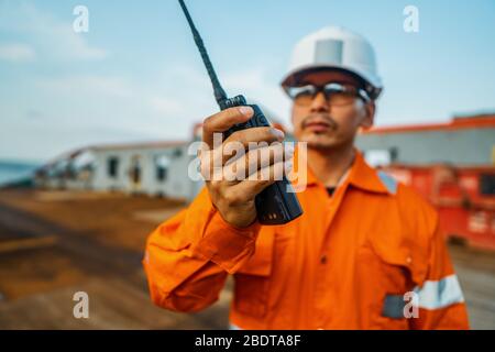 Filipino deck Officer on deck of vessel or ship , wearing PPE personal protective equipment Stock Photo