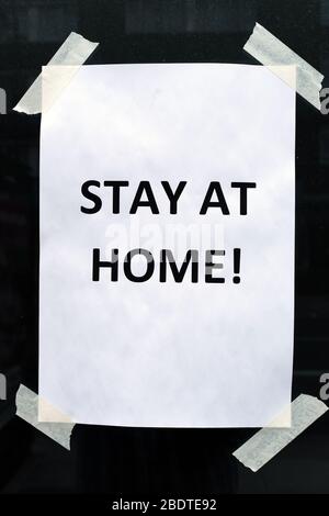 Stay At Home sign posted in hotel window during Covid-19 pandemic, London, England Stock Photo