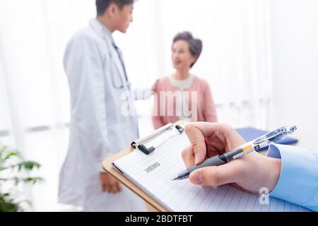 The doctor talked with elderly patients Stock Photo