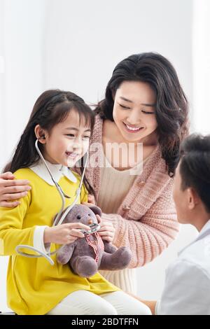 Young mothers with children see a doctor Stock Photo