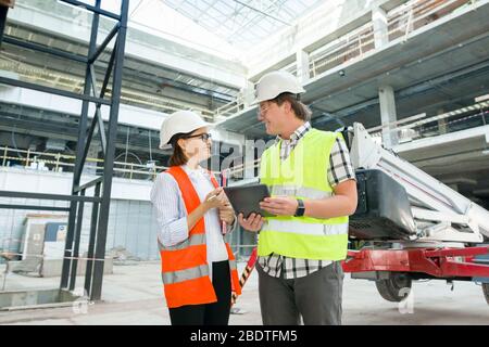 Industrial portrait of male and female construction engineers Stock Photo