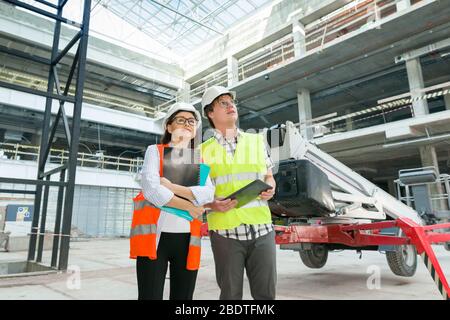 Industrial portrait of male and female construction engineers Stock Photo