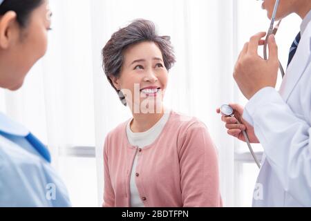 The doctor talked with elderly patients Stock Photo