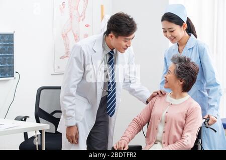 The doctor talked with elderly patients Stock Photo