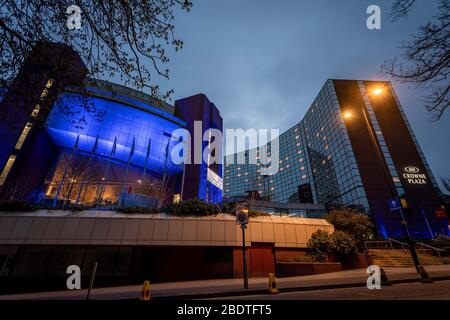 Harrogate, North Yorkshire, UK. 09th Apr, 2020. The Harrogate Convention Centre is lit up blue to celebrate the NHS. The Conventino Centre is currently being converted into a Nightingale Hospital for Yorkshire and Humber. Harrogate, United Kingdom. 9th April, 2020. Harrogate, North Yorkshire, UK. Credit: Caught Light Photography/Alamy Live News. Credit: Caught Light Photography Limited/Alamy Live News Stock Photo