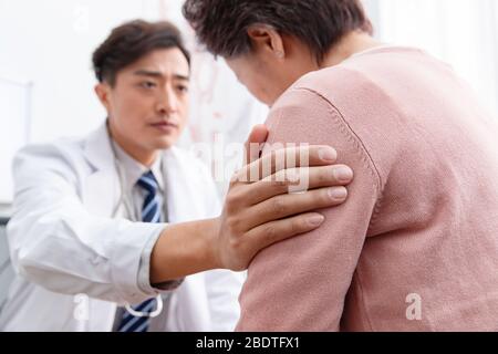 The doctor talked with elderly patients Stock Photo