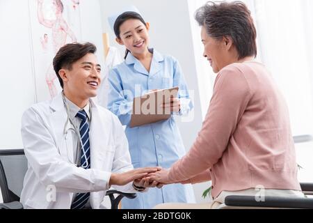The doctor talked with elderly patients Stock Photo