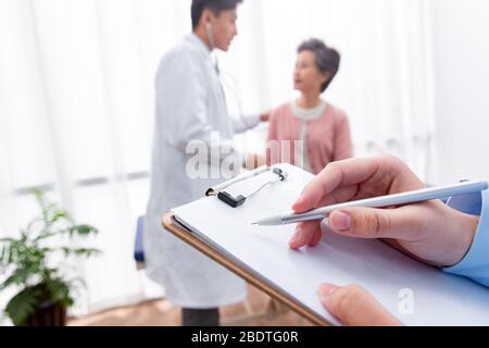 The doctor talked with elderly patients Stock Photo