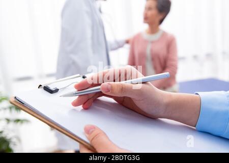 The doctor talked with elderly patients Stock Photo