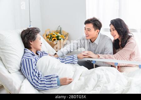 Young couples, visit sick old people Stock Photo