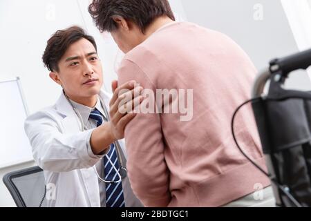 The doctor talked with elderly patients Stock Photo