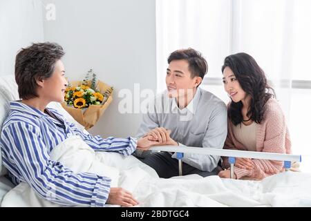 Young couples, visit sick old people Stock Photo