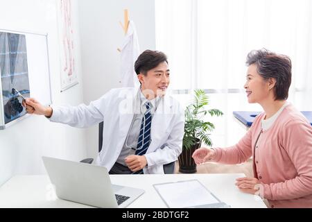 The doctor talked with elderly patients Stock Photo
