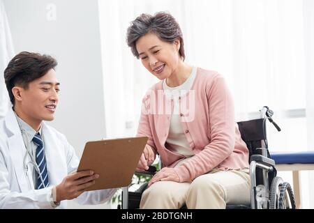 The doctor talked with elderly patients Stock Photo