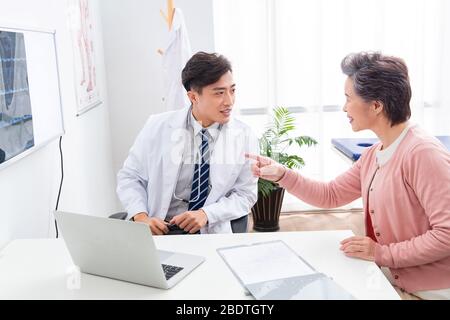 The doctor talked with elderly patients Stock Photo