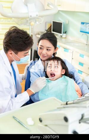The dentist to check teeth little girl Stock Photo