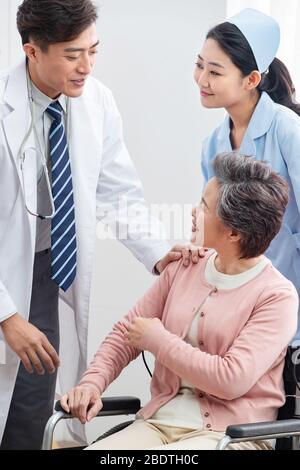 The doctor talked with elderly patients Stock Photo