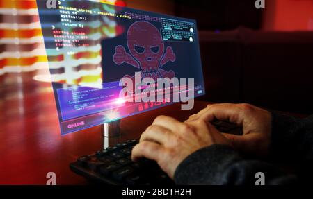 Hacker typing on the keyboard and breaks computer security on virtual hologram screen on desk. Cyber attack, cybercrime, piracy, digital safety and id Stock Photo