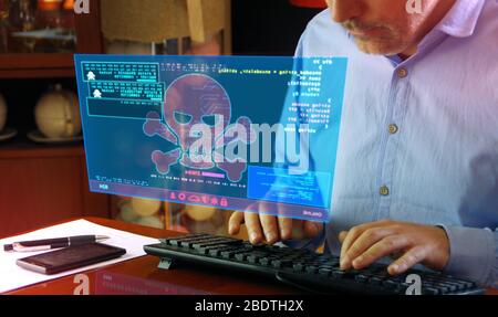Hacker typing on the keyboard and breaks computer security on virtual hologram screen on desk. Cyber attack, cybercrime, piracy, digital safety and id Stock Photo