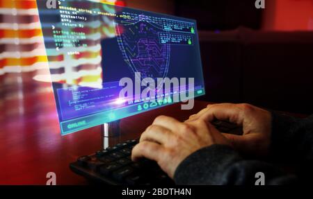 Man typing computer keyboard with futuristic hologram screen. Abstract concept of cyber security, computer protection, programming and internet safety Stock Photo