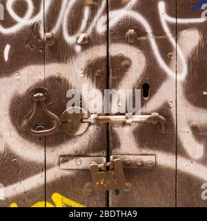 Graffitied wooden door in Barcelona. Stock Photo