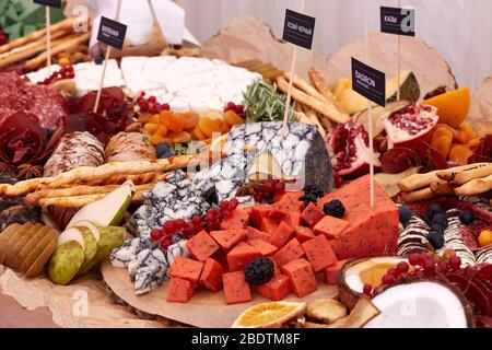 A close up of many different types of apitizers. Italian antipasti wine snacks set. Stock Photo