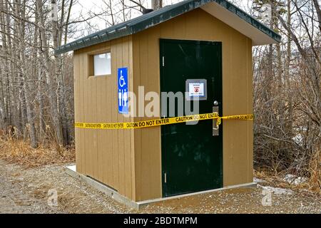 An outhouse closed because of the Covid-19 pandemic in rural Alberta Canada Stock Photo