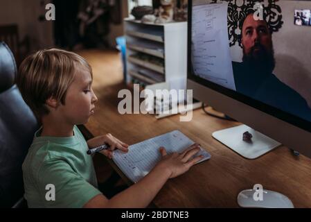 Close up view of young student taking online class during isolation Stock Photo