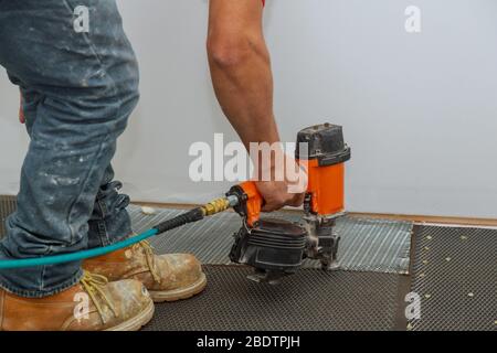 Reinforcing metal wire installing tiles preparation of the surface for tiling. Stock Photo