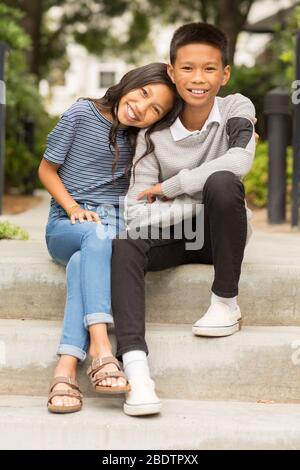 Portrait of an Asian brother and his little sister. Stock Photo