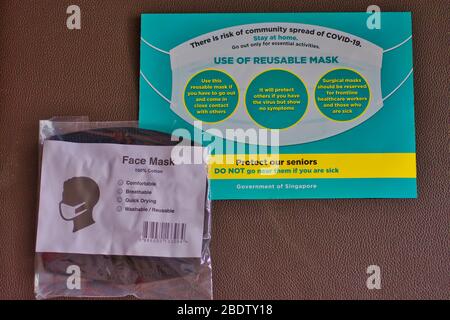 Free reusable and washable face masks are distributed by Singapore authority during the COVID-19 crisis, to prevent the community spread of virus. Stock Photo