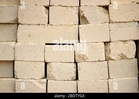 Concrete Cement Block bricks in stack for wall construction. Dirty Old Texture Stock Photo