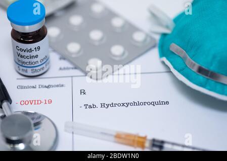 Doctor prescribing hydroxychloroquine for the treatment of novel coronavirus covid-19 Stock Photo