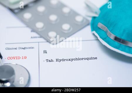 Doctor prescribing hydroxychloroquine for the treatment of novel coronavirus covid-19 Stock Photo