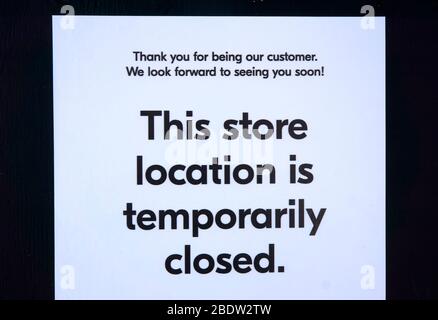 Vancouver, Canada, 09 April 2020. A store displays a temporarily closed sign on its door during the COVD-19 pandemic. Stock Photo