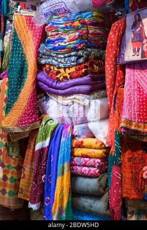 Colourful clothes for sale Jindani Chowk Jaisalmer Rajasthan India Stock Photo