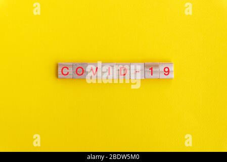 Covid - 19 word on wooden block - Corona virus concept Stock Photo