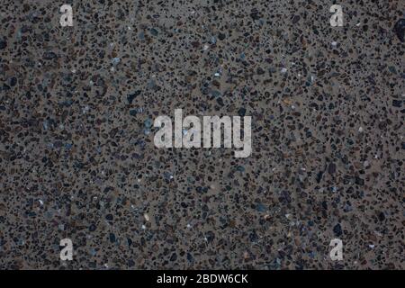 Sea sand with remnants of shells and small pebbles. Background. Stock Photo