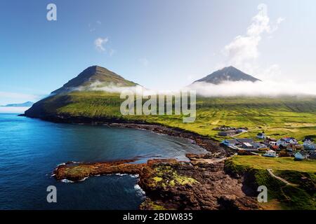 Picturesque view on village of Gjogv with typically colourful houses on the Eysturoy island, Faroe Islands, Denmark. Landscape photography Stock Photo