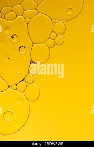 Abstract, image of oil, water and soap in a glass bowl with colourful background Stock Photo