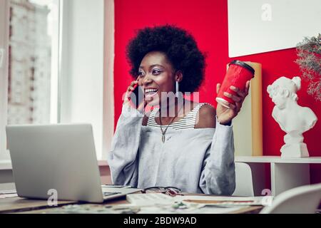 Amazing African American designer having break during work Stock Photo