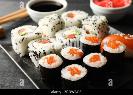 Tray with delicious sushi rolls, close up. Japanese food Stock Photo