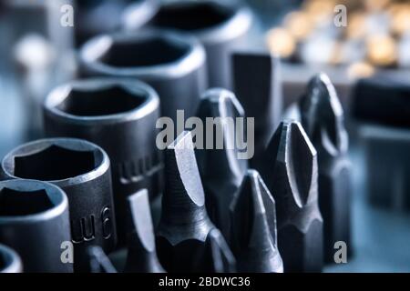 Closeup of different bits set and wrenches close up Stock Photo